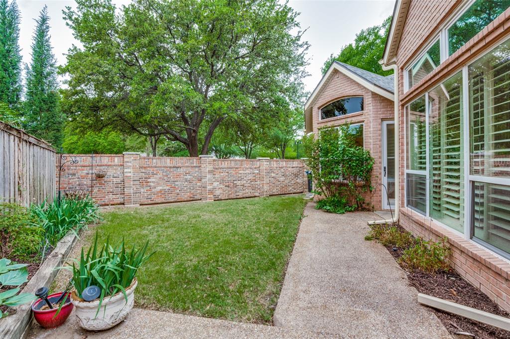 3752 Park Place Addison, TX 75001 - Photo 24 of 25 This property features a private yard with a well-maintained lawn and mature trees