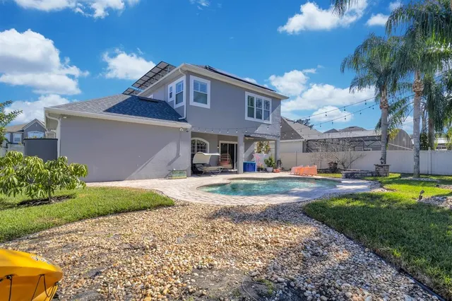 a front view of house with yard and lake view