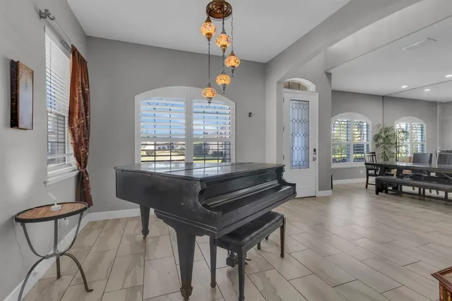 a view of a livingroom with furniture and a piano