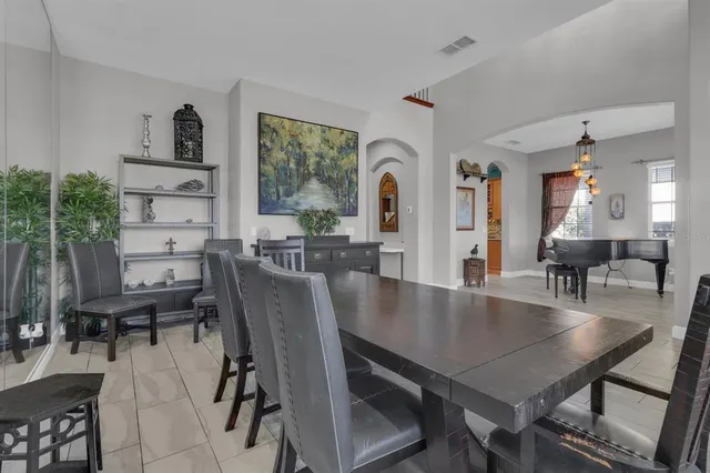a view of a dining room with furniture and a large window
