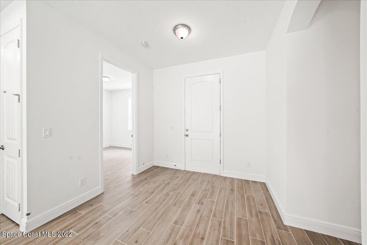 1296 Daton Road Southwest Palm Bay, FL 32908 - Photo 9 of 32 a view of a room with wooden floor
