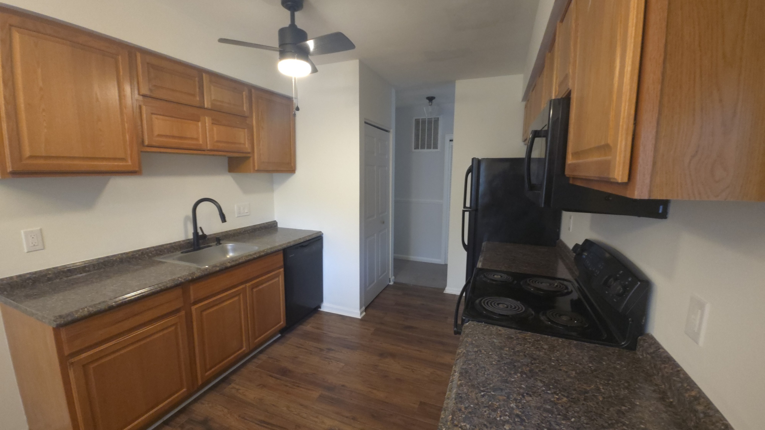 365 Mather Street, Unit 39 Hamden, CT 06514 - Photo 12 of 37 a kitchen with stainless steel appliances granite countertop a stove a sink and a refrigerator