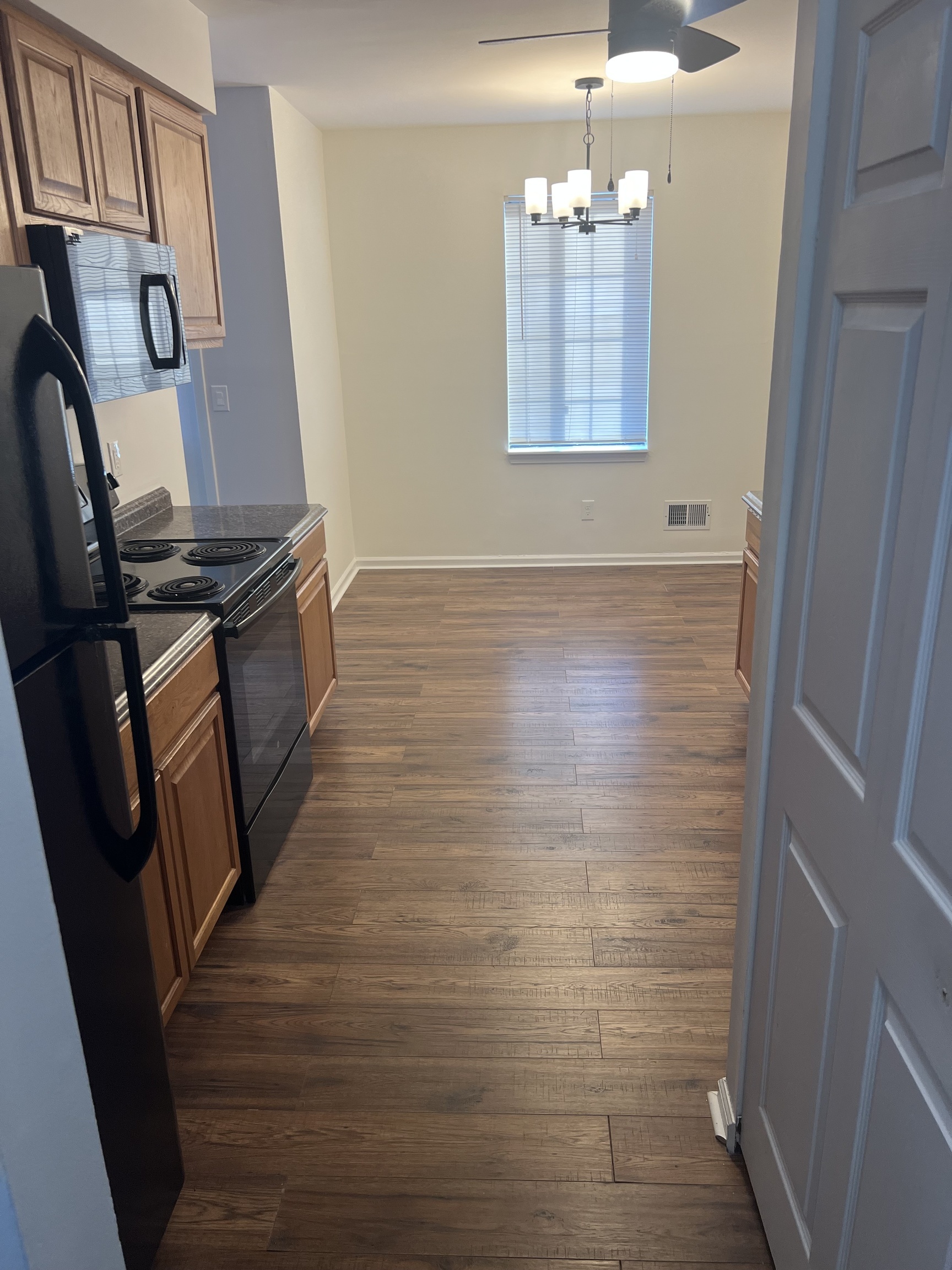 365 Mather Street, Unit 39 Hamden, CT 06514 - Photo 15 of 37 a room with wooden floor and potted plant
