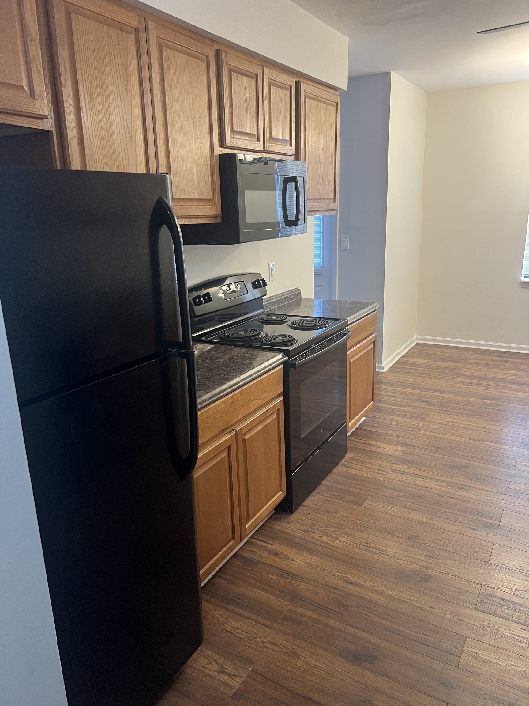 365 Mather Street, Unit 39 Hamden, CT 06514 - Photo 17 of 37 a kitchen with a refrigerator stove and cabinets