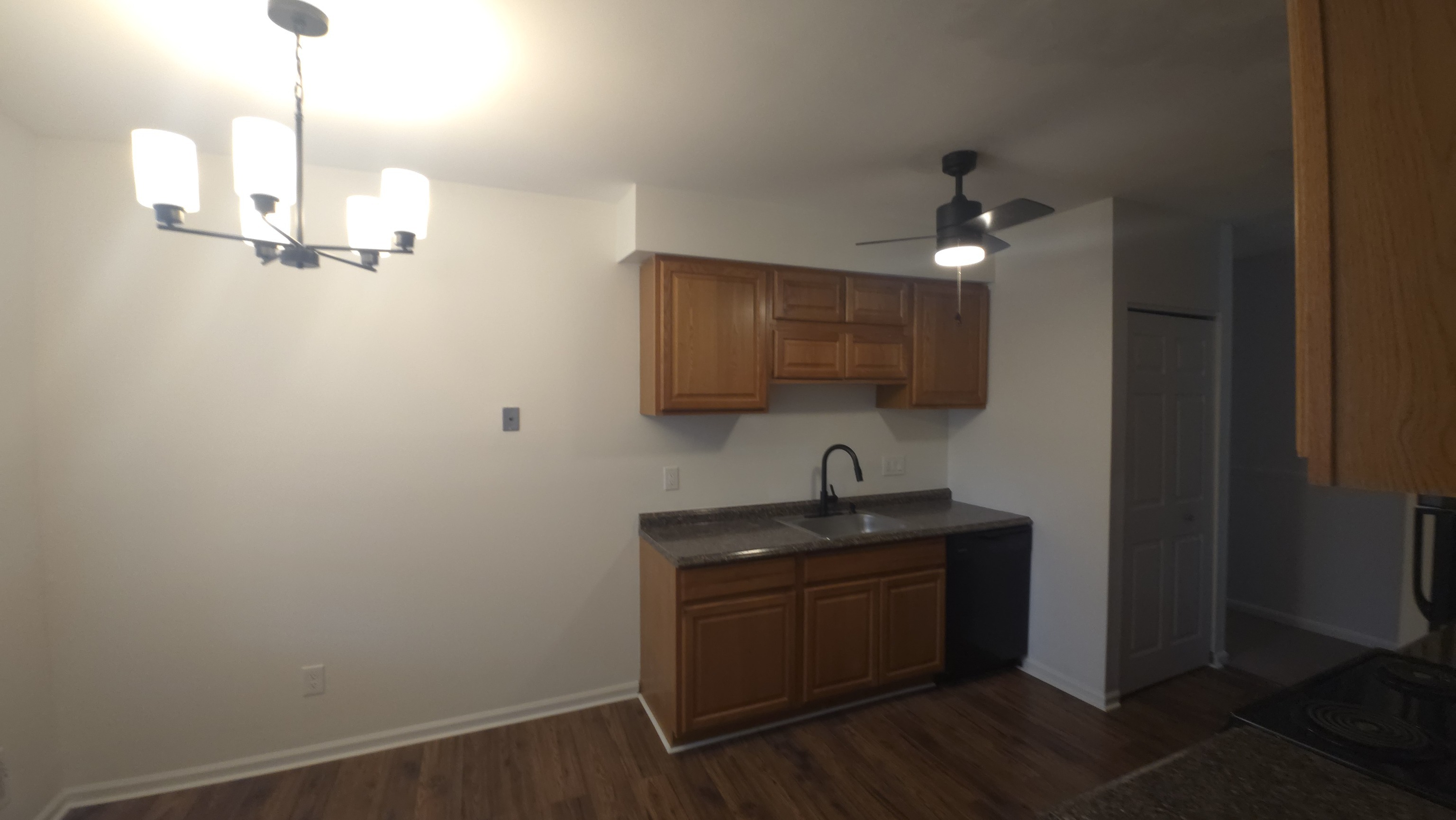 365 Mather Street, Unit 39 Hamden, CT 06514 - Photo 18 of 37 a kitchen with a sink cabinets and wooden floor