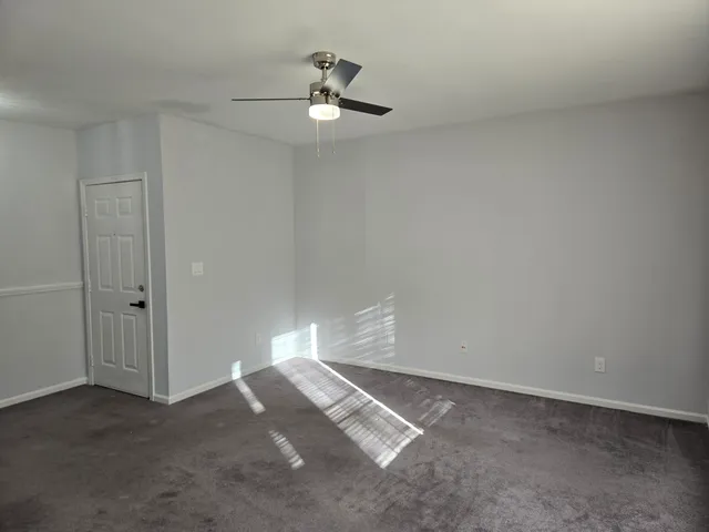 an empty room with a empty space and a window