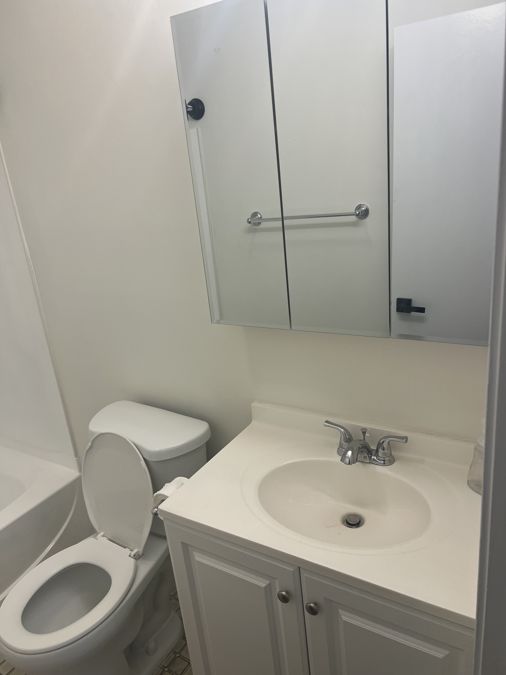 365 Mather Street, Unit 39 Hamden, CT 06514 - Photo 23 of 37 a bathroom with a toilet sink and mirror