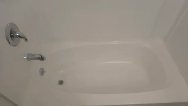 an empty room with a ceiling fan and a window