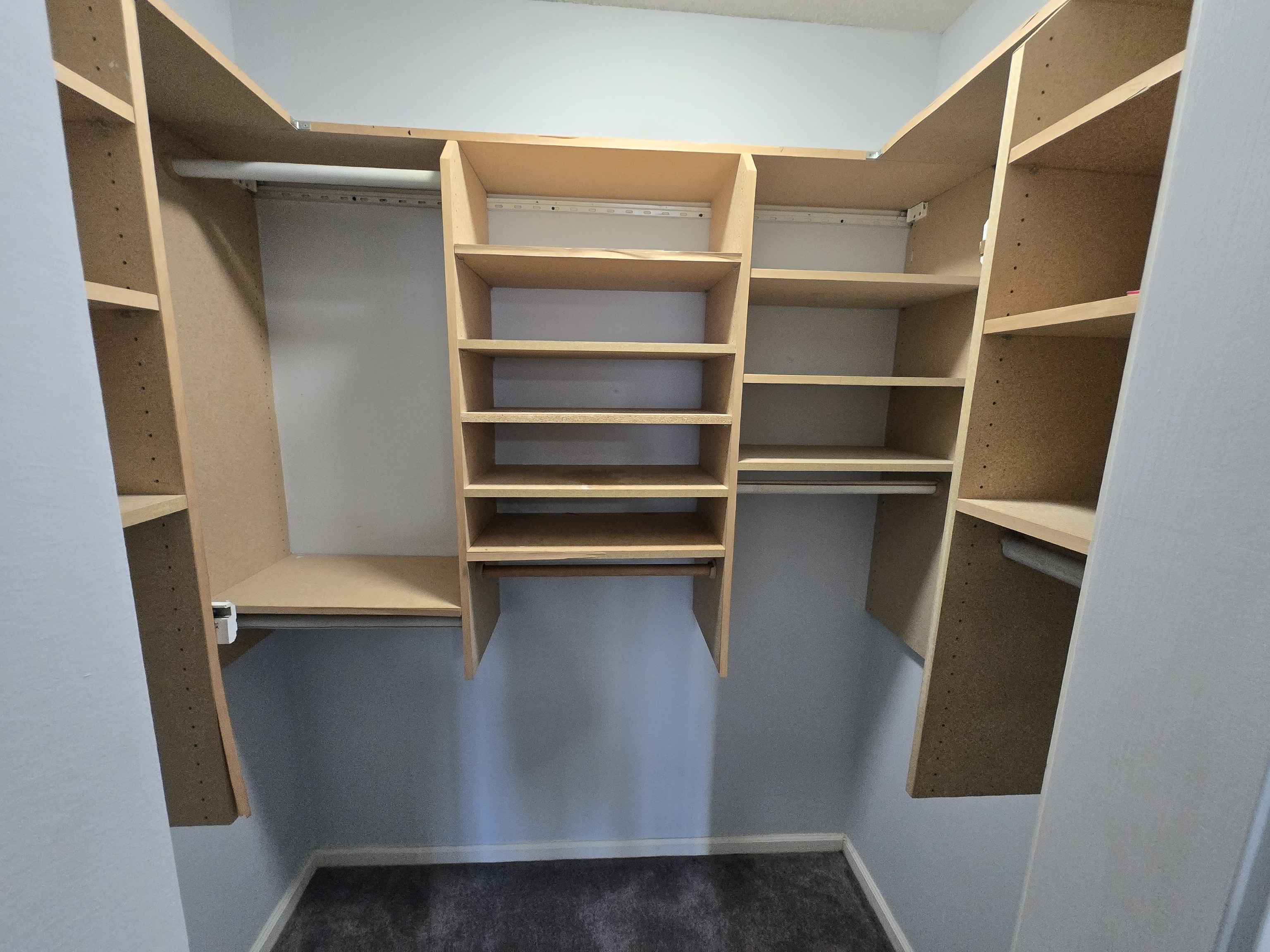 365 Mather Street, Unit 39 Hamden, CT 06514 - Photo 28 of 37 a view of walk in closet with empty racks