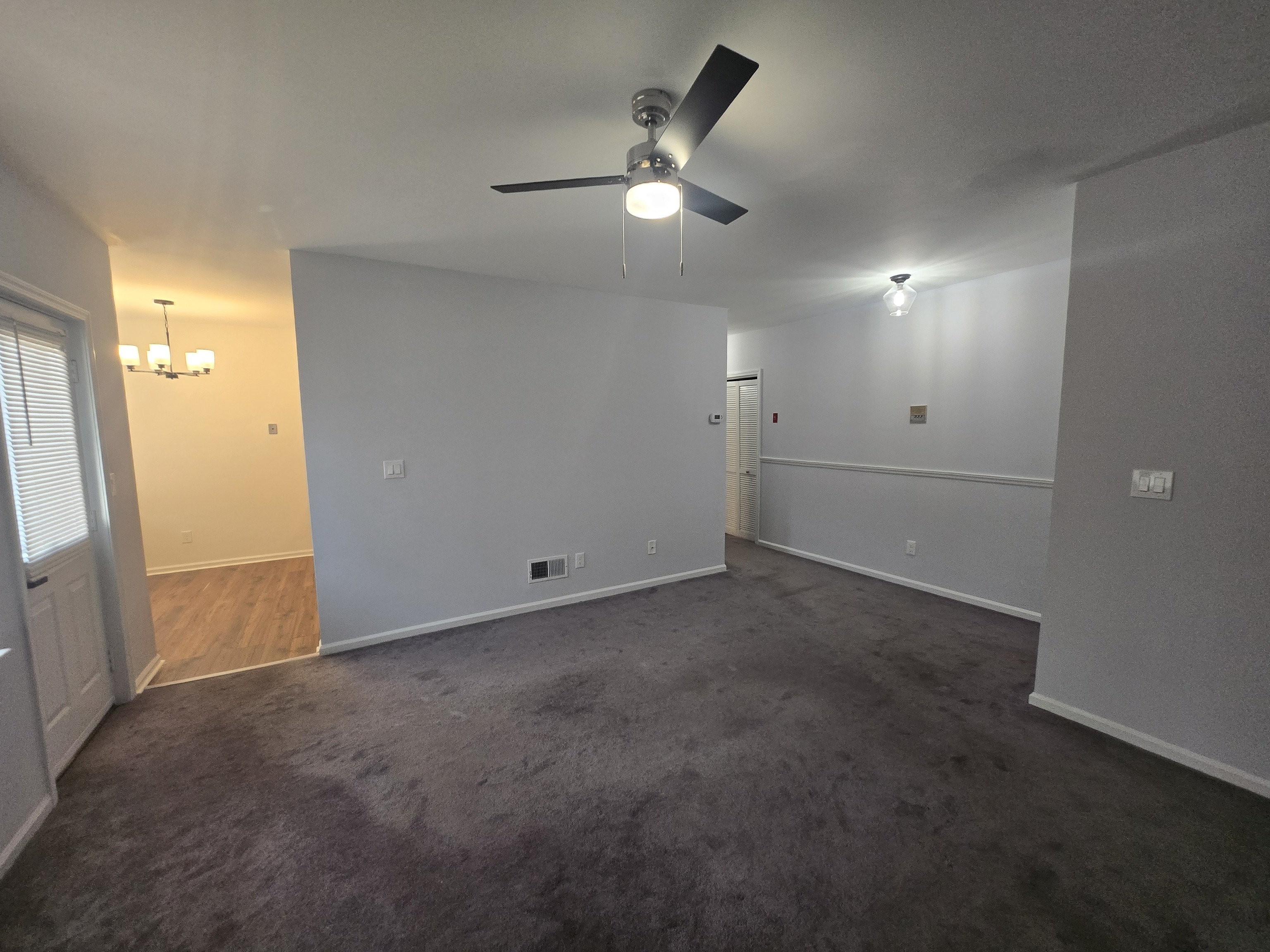 365 Mather Street, Unit 39 Hamden, CT 06514 - Photo 4 of 37 an empty room with closet and a ceiling fan