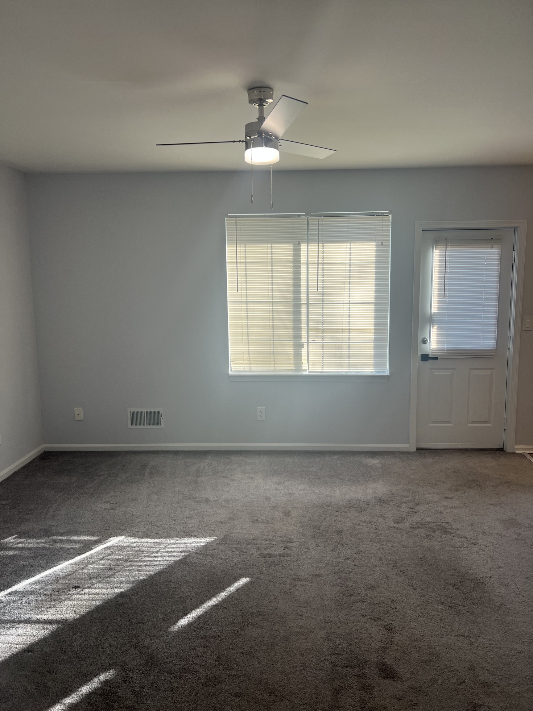 365 Mather Street, Unit 39 Hamden, CT 06514 - Photo 6 of 37 an empty room with windows and fan