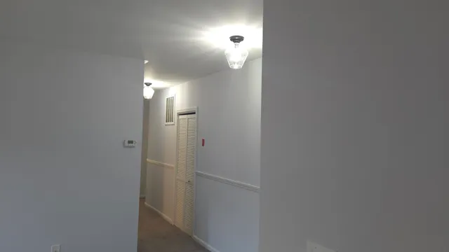 a view of a hallway with closet area