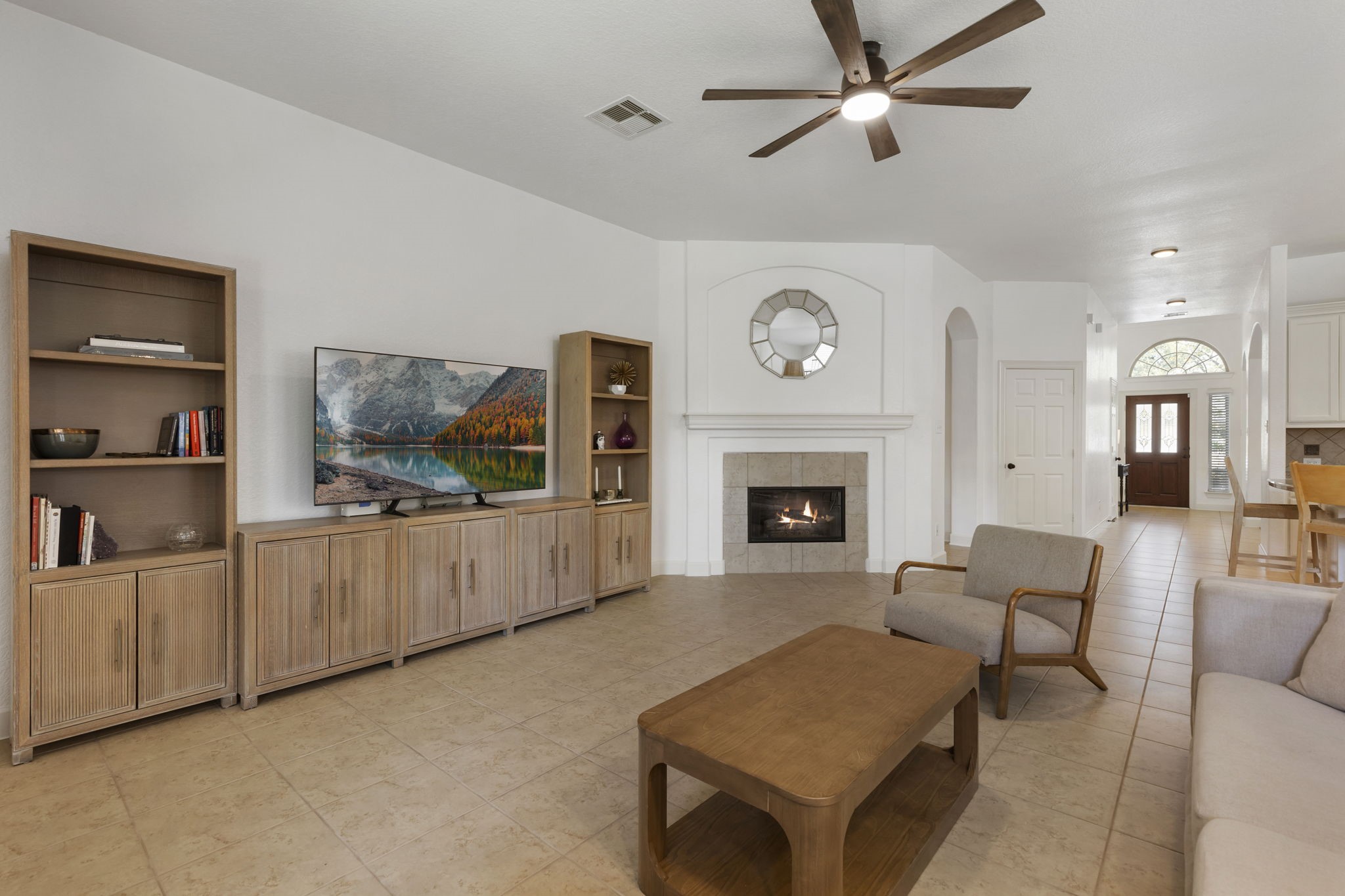 71 Sagamore Ridge Place The Woodlands, TX 77389 - Photo 18 of 34 a living room with furniture and a fireplace