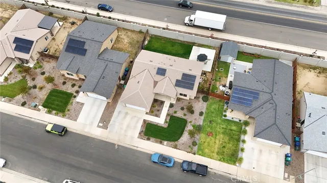 an aerial view of residential house with outdoor space and parking