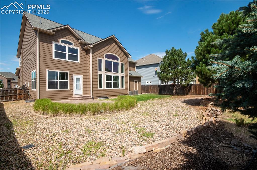 9443 St.George Road Peyton, CO 80831 - Photo 40 of 45 a front view of a house with a yard