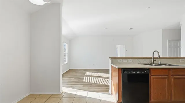 a view of kitchen with a sink and dishwasher