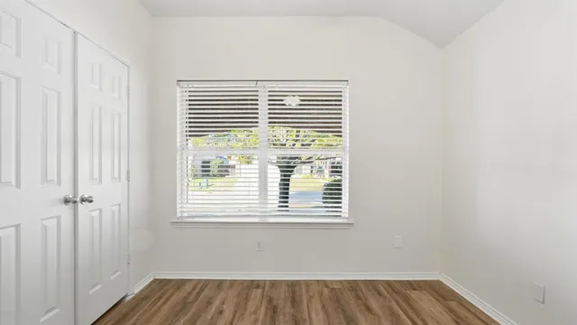 a view of a room that has a window in it