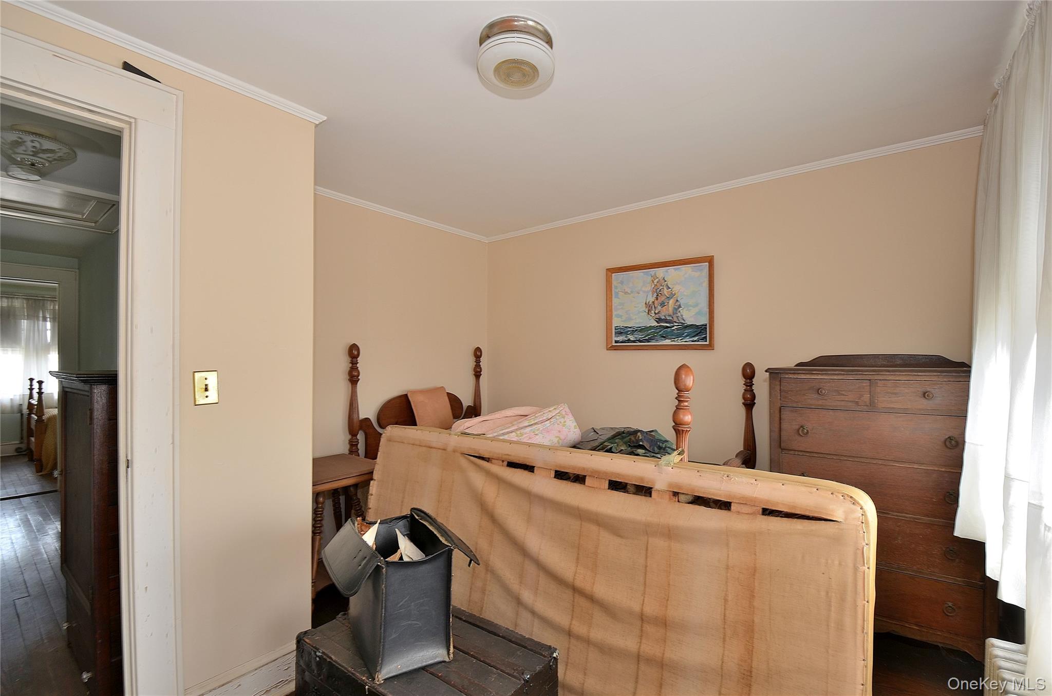 2586 Riverside Drive Wantagh, NY 11793 - Photo 6 of 9 This room features light-colored walls and a window with white curtains