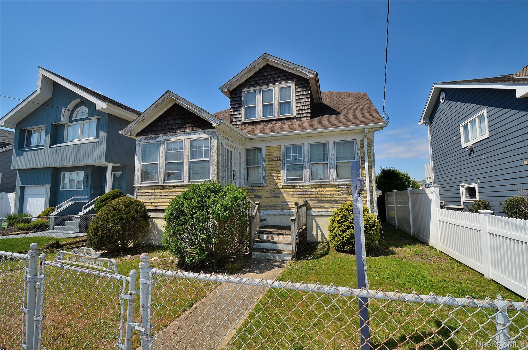 2586 Riverside Drive Wantagh, NY 11793 - Photo 10 of 10 Two-story residence with a prominent gabled roofline and front bay window
