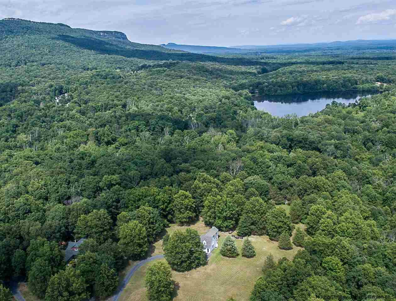 460 Decker Road Wallkill, NY 12589 - Photo 1 of 27 a view of a lush green outdoor space with a lake view