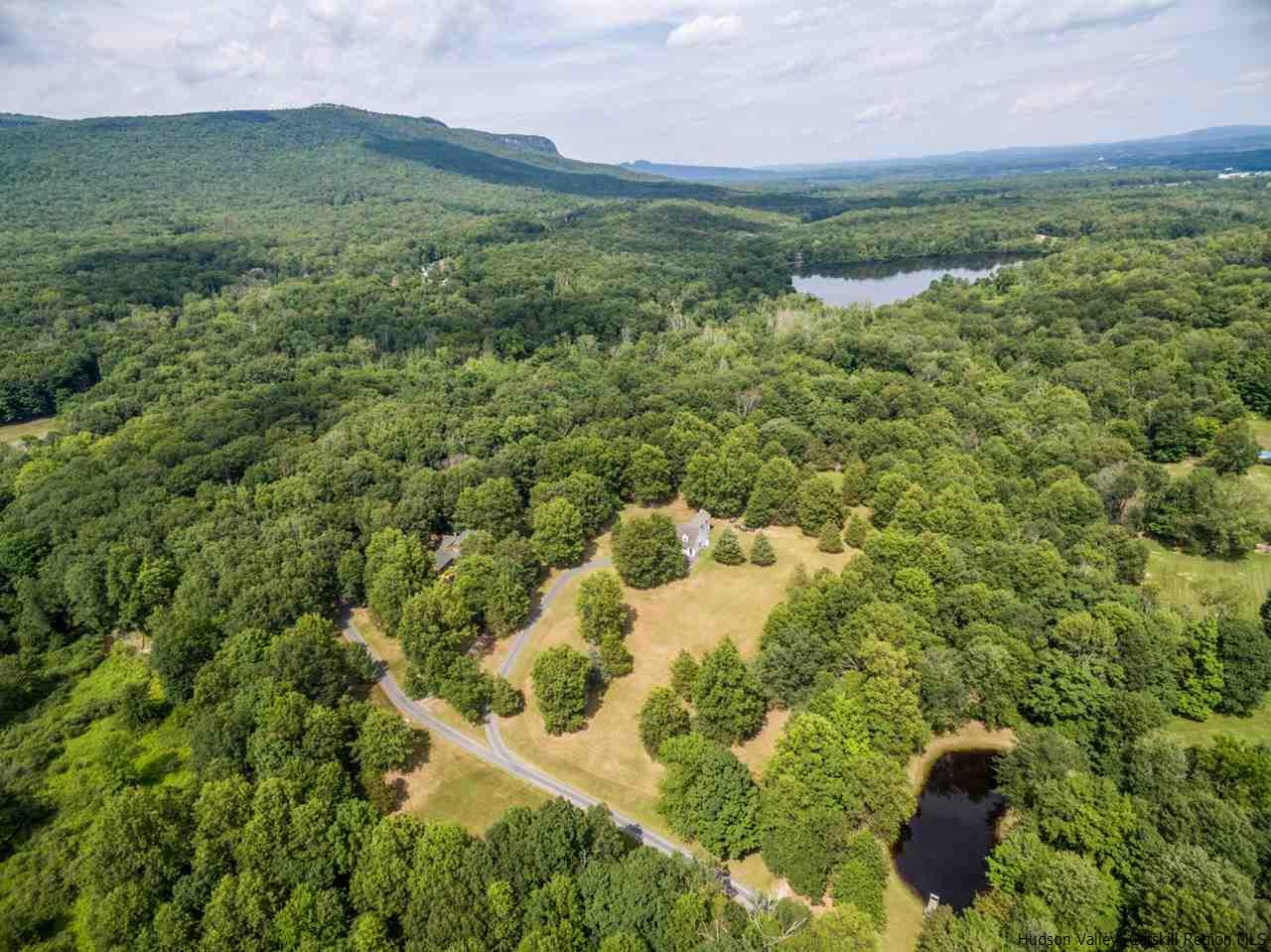 460 Decker Road Wallkill, NY 12589 - Photo 27 of 27 a view of a lush green forest with a house