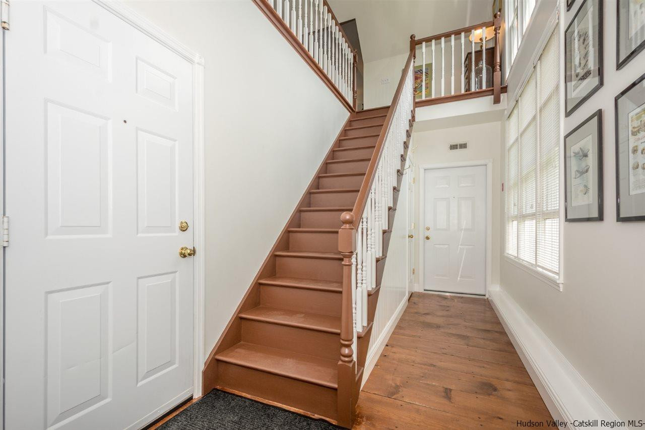 460 Decker Road Wallkill, NY 12589 - Photo 6 of 27 a view of a hallway with wooden floor and entryway