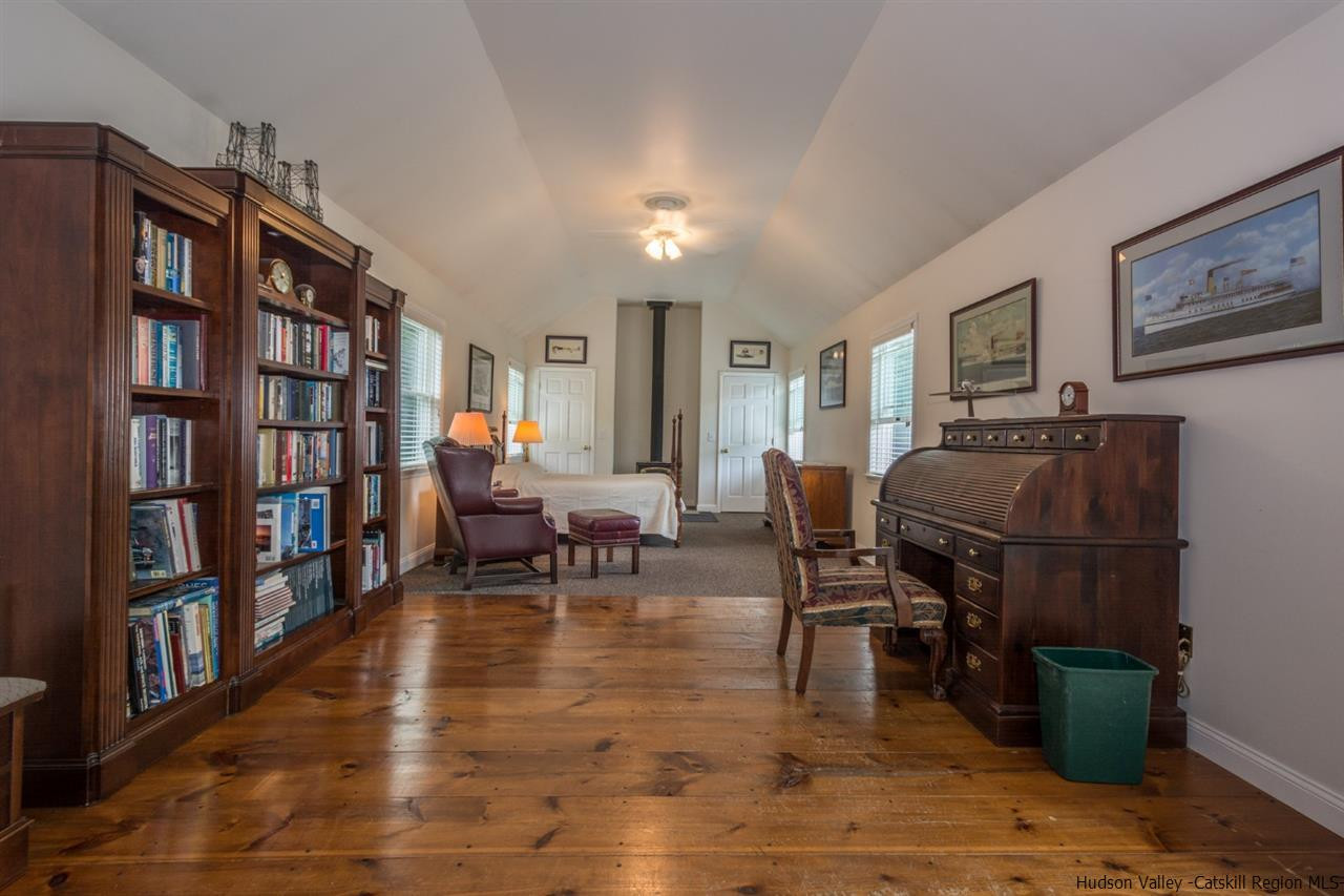 460 Decker Road Wallkill, NY 12589 - Photo 9 of 27 a living room with furniture and a book shelf