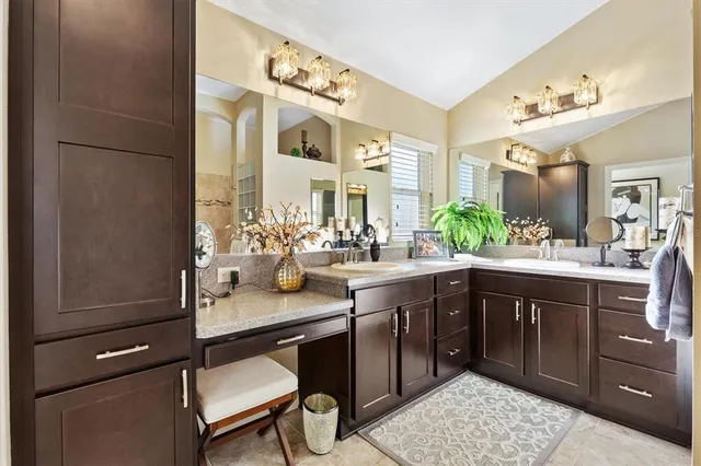 a spacious bathroom with a shower sink and mirror