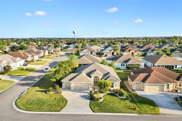 an aerial view of residential building and parking space