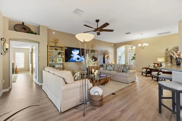 a living room with furniture and a large window