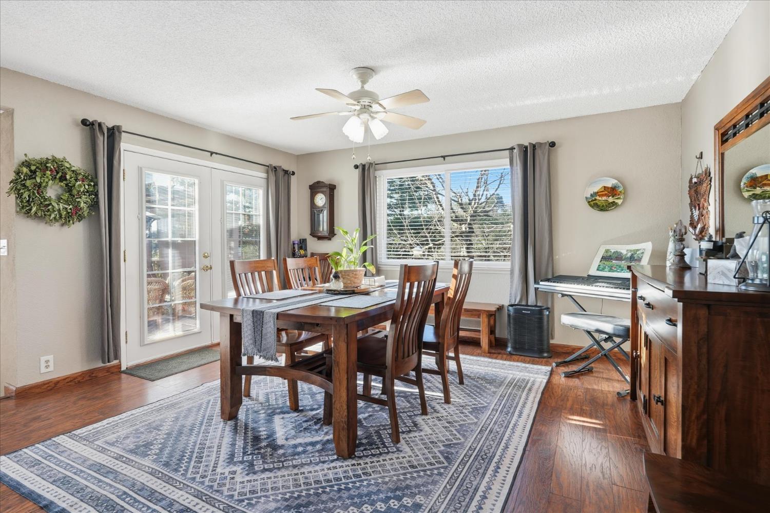 40182 Alerna Way Oakhurst, CA 93644 - Photo 11 of 49 a view of a dining room with furniture window and wooden floor