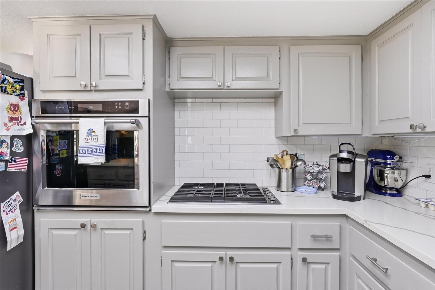 40182 Alerna Way Oakhurst, CA 93644 - Photo 14 of 49 a kitchen with white cabinets and sink