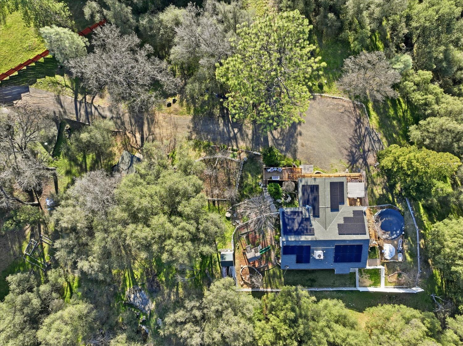 40182 Alerna Way Oakhurst, CA 93644 - Photo 19 of 49 an aerial view of a house with swimming pool and garden