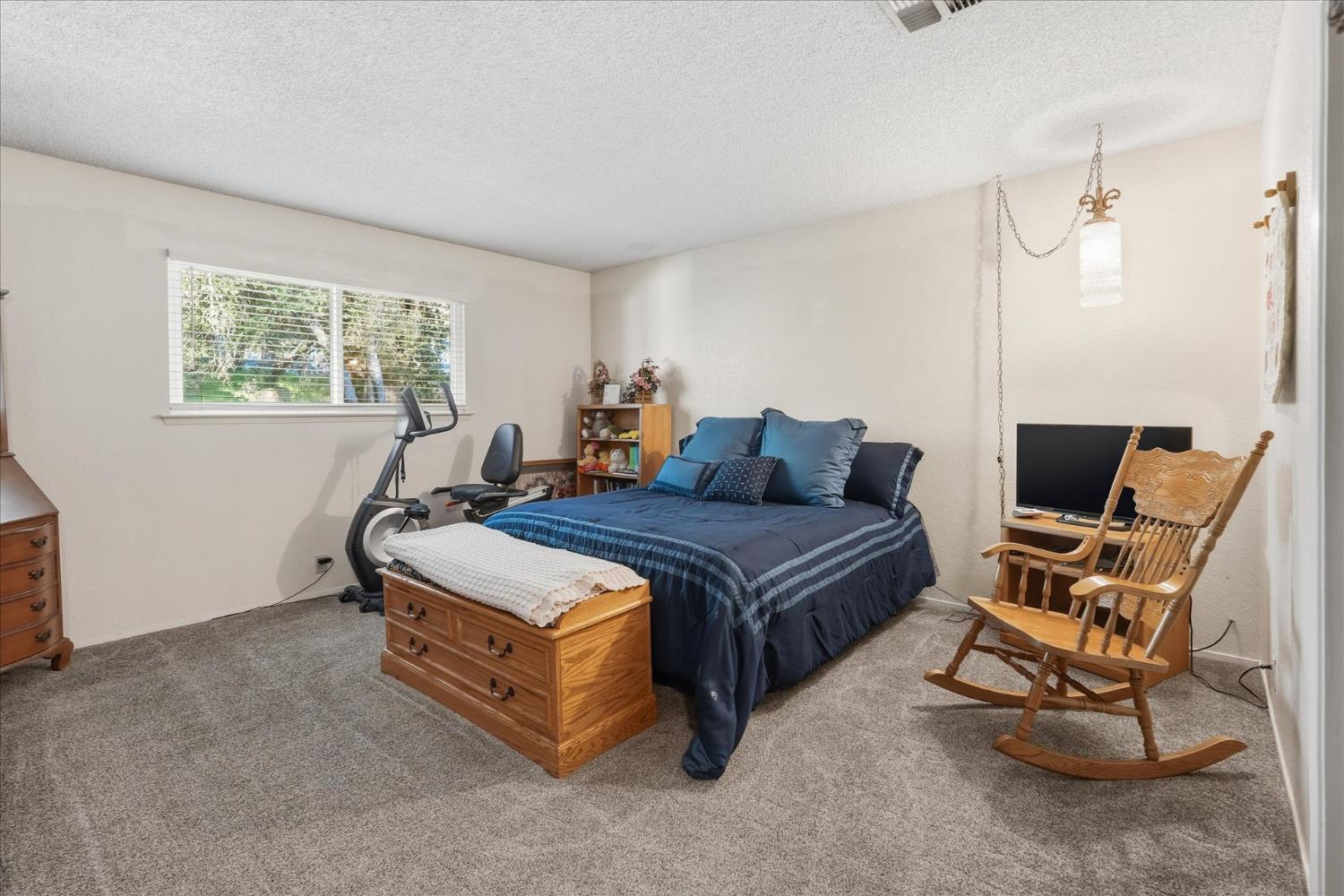 40182 Alerna Way Oakhurst, CA 93644 - Photo 23 of 49 a bedroom with a bed and a window