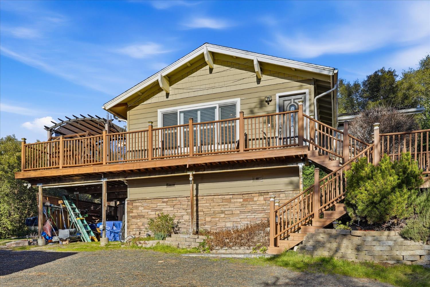 40182 Alerna Way Oakhurst, CA 93644 - Photo 3 of 49 a front view of a house with parking