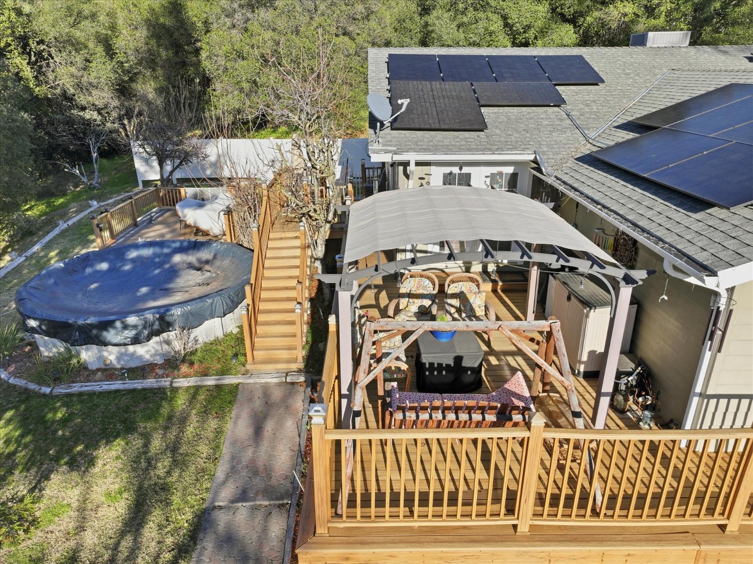 40182 Alerna Way Oakhurst, CA 93644 - Photo 31 of 49 a view of a balcony with two chairs and a table
