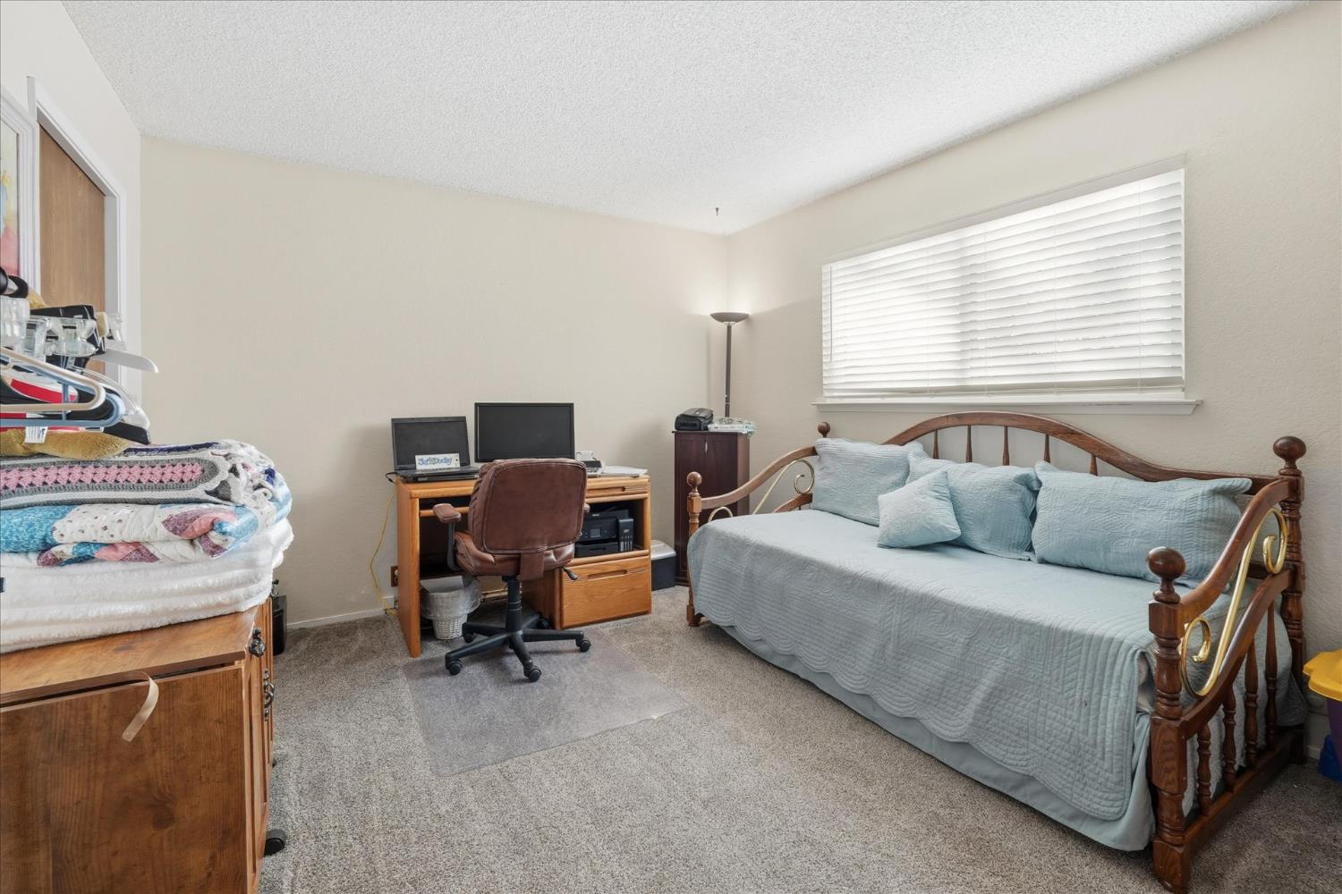 40182 Alerna Way Oakhurst, CA 93644 - Photo 31 of 49 a bedroom with a workspace