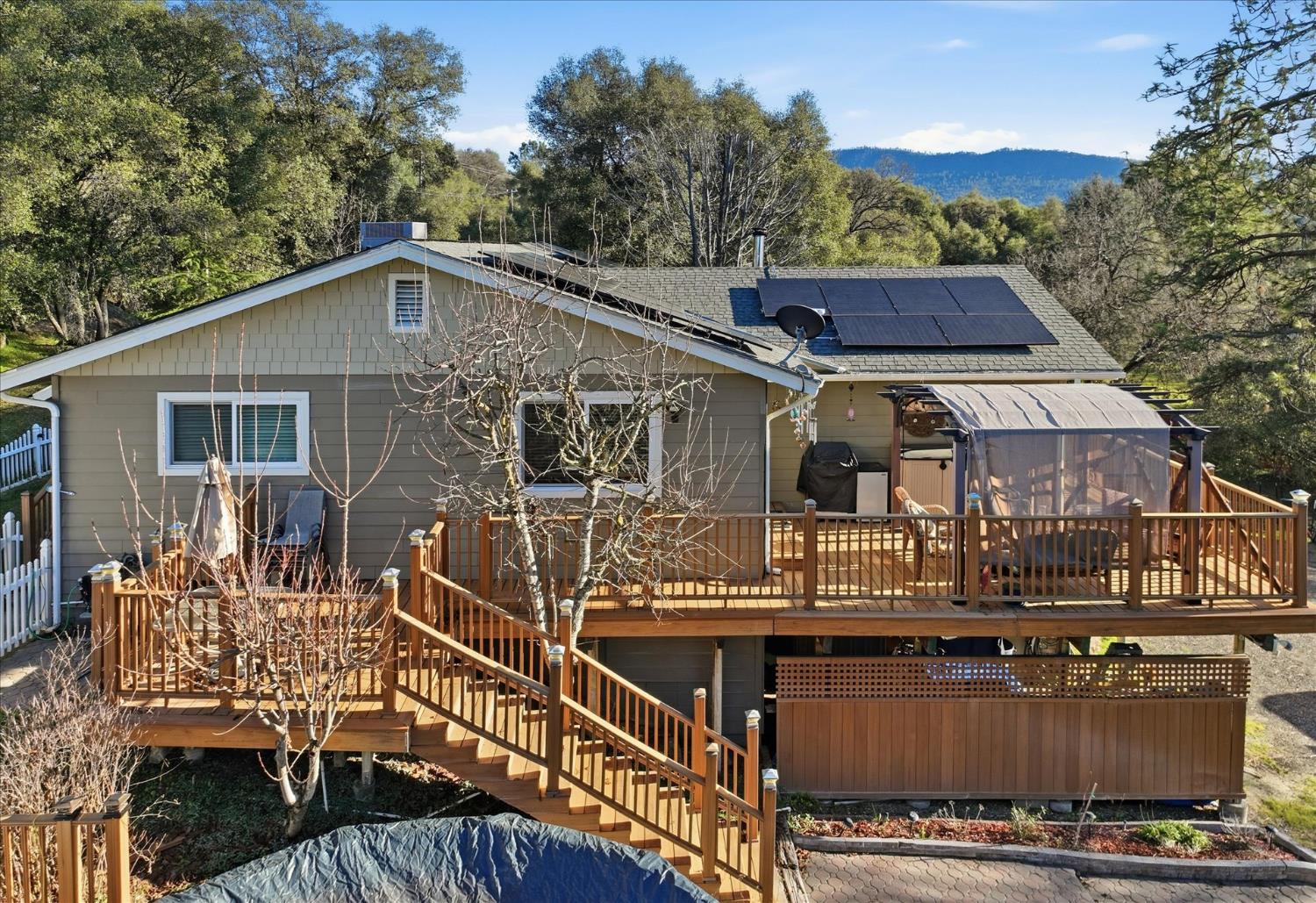 40182 Alerna Way Oakhurst, CA 93644 - Photo 34 of 49 a front view of a house with a balcony