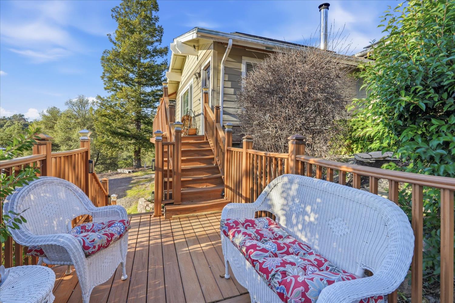 40182 Alerna Way Oakhurst, CA 93644 - Photo 38 of 49 a balcony with wooden floor table and chairs