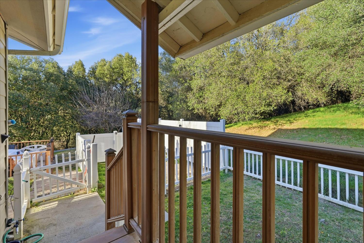 40182 Alerna Way Oakhurst, CA 93644 - Photo 39 of 49 a view of a porch with wooden floor and yard