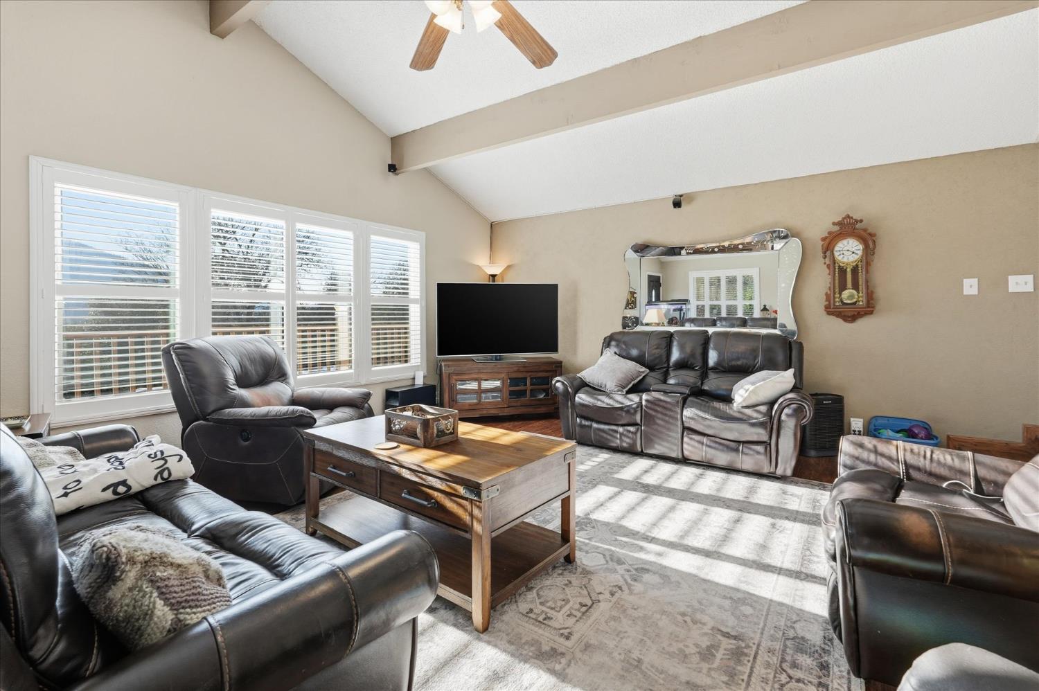 40182 Alerna Way Oakhurst, CA 93644 - Photo 44 of 49 a living room with furniture and a flat screen tv