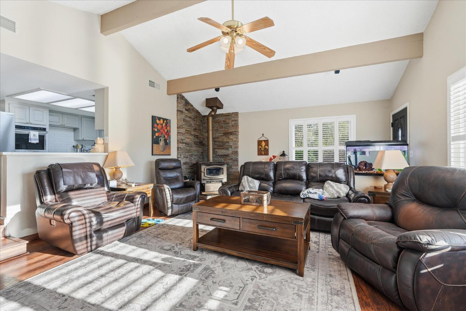 40182 Alerna Way Oakhurst, CA 93644 - Photo 45 of 49 a living room with furniture ceiling fan and a rug