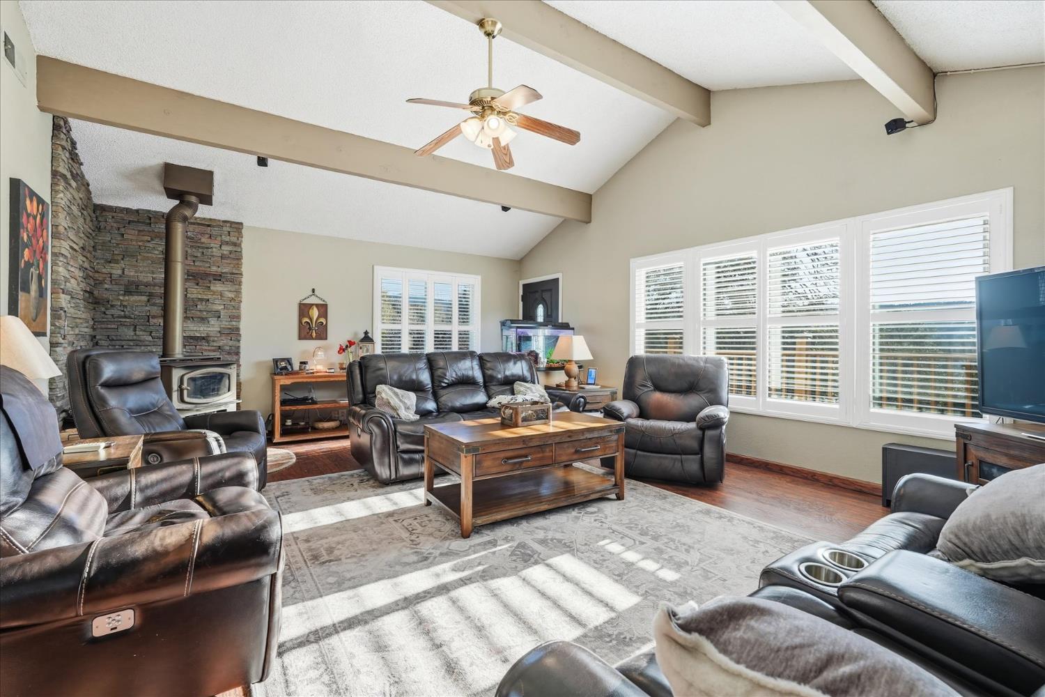 40182 Alerna Way Oakhurst, CA 93644 - Photo 8 of 49 a living room with furniture wooden floor and large windows