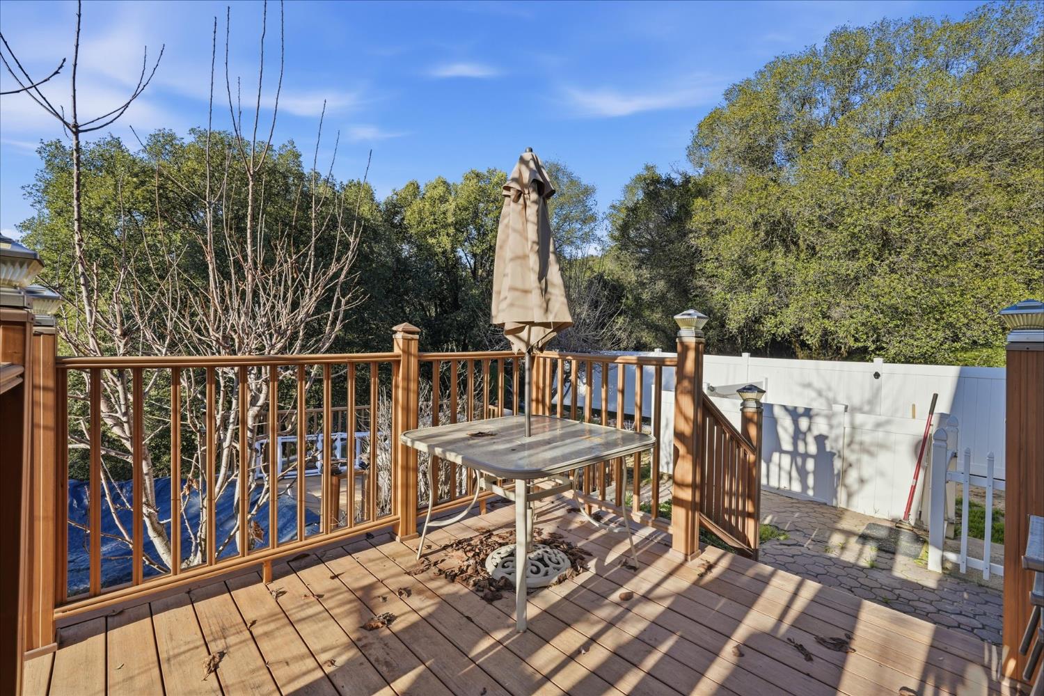 40182 Alerna Way Oakhurst, CA 93644 - Photo 10 of 49 a view of a chairs and table on the deck