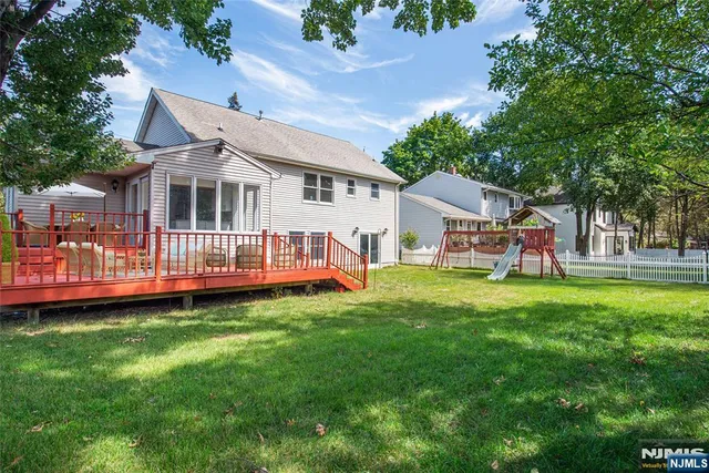 a view of a house with a yard porch and sitting area