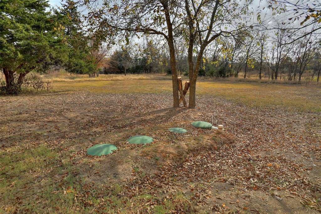 625 Simpson Road Princeton, TX 75407 - Photo 12 of 24 a view of dirt field with trees