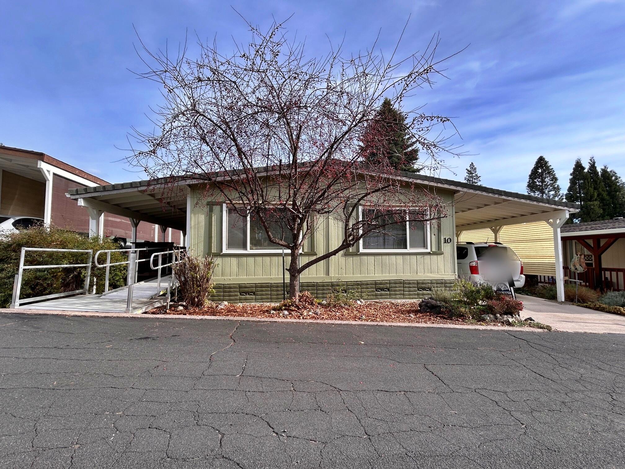 1934 South Old Stage Road, Unit SPC 10 Mount Shasta, CA 96067 - Photo 2 of 12 a front view of a house with garden
