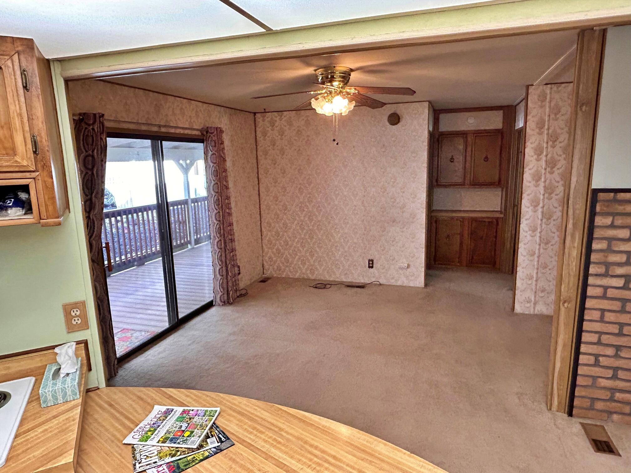 1934 South Old Stage Road, Unit SPC 10 Mount Shasta, CA 96067 - Photo 4 of 12 a view of an empty room with a fireplace