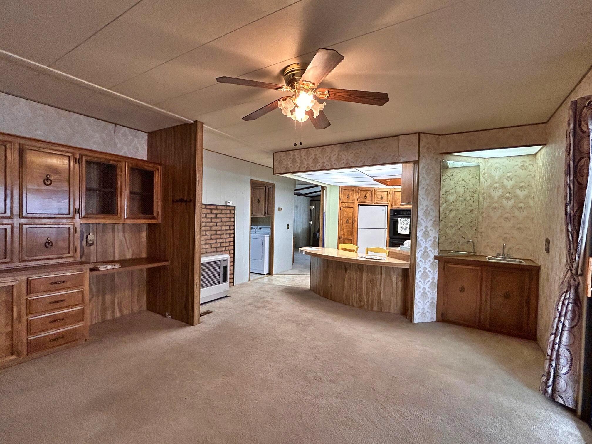 1934 South Old Stage Road, Unit SPC 10 Mount Shasta, CA 96067 - Photo 7 of 12 a living room with furniture and a flat screen tv