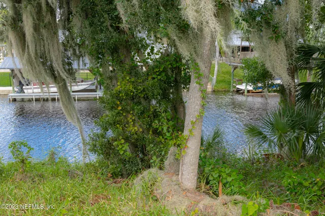 a view of yard with swimming pool and outdoor seating